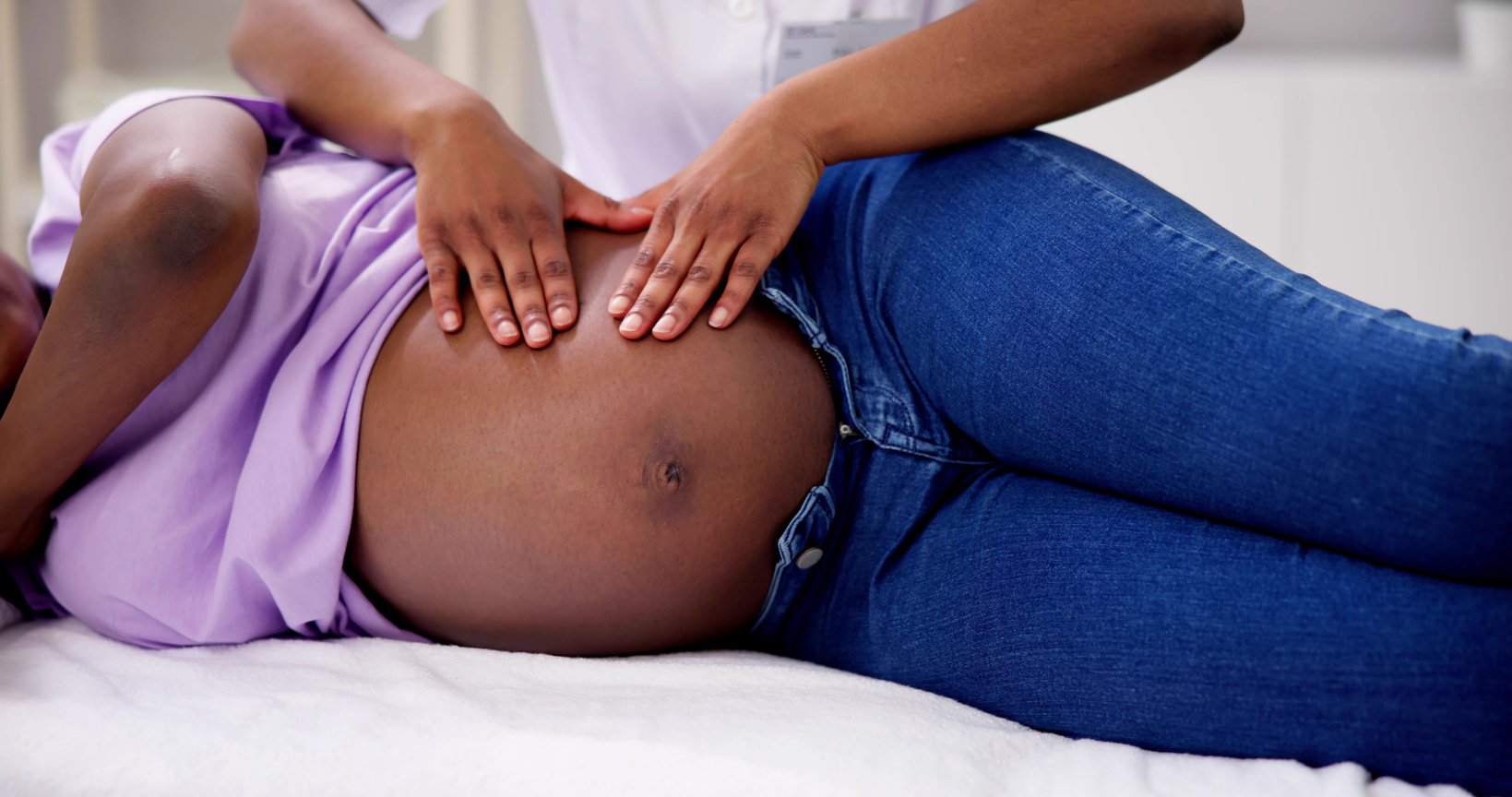 Pregnant Woman Receiving Prenatal Massage at the Spa