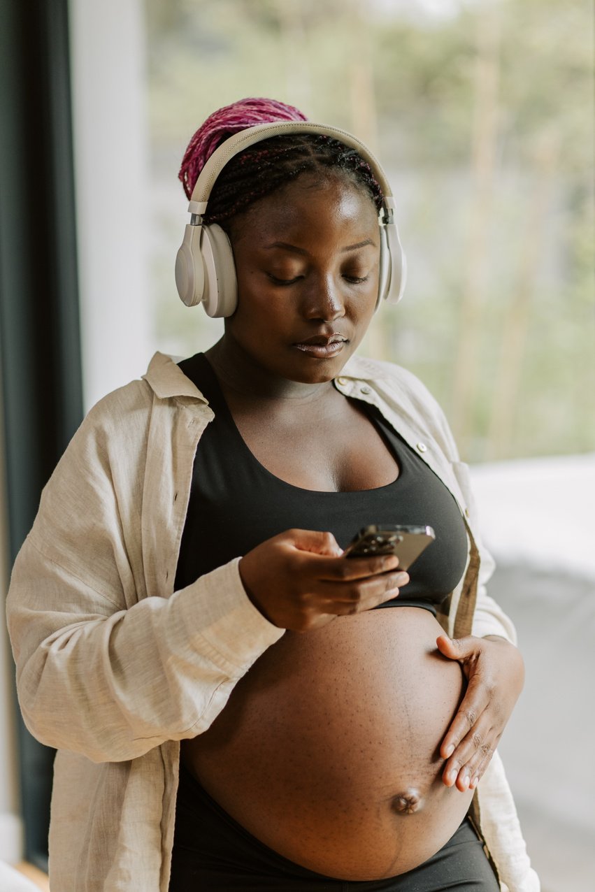 Pregnancy at Home Pregnant Woman Listening to Music